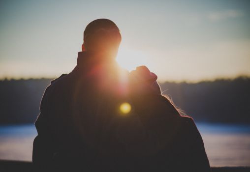 couple standing in sunset